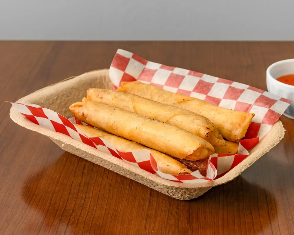 Lumpia Shanghai, crispy Filipino spring rolls with sweet chili dip at Sagana Foods, Filipino restaurant in Calgary, AB